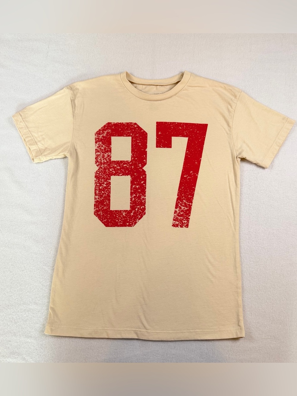 Grayson Threads Beige Short-Sleeve Tee with Distressed Red '87'